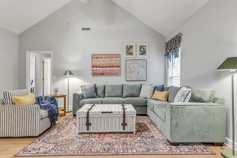 Living room with high vaulted ceilings.