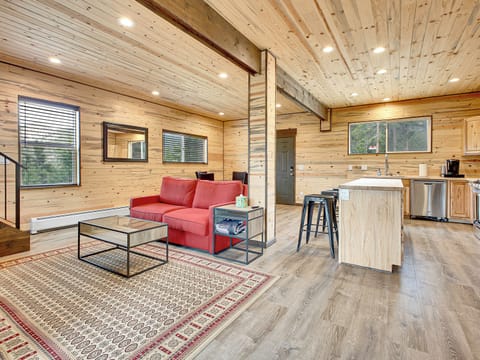 Cozy up in the open-concept living room — perfect for cool mountain mornings and crisp autumn nights.