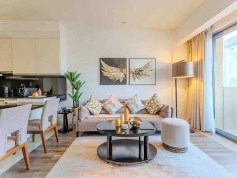 Stylish retreat with modern decor, vibrant cushions, and inviting natural light!