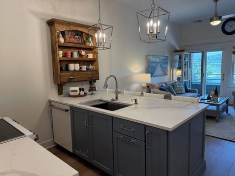 Kitchen features a recycling center for trash, recyclables, and Michigan can/bottle returns.