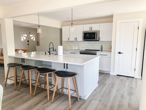 Kitchen: Large island w/ stools, sink, dishwasher & cooking essentials