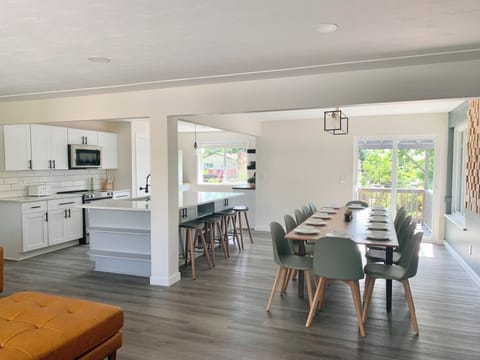 Open concept Living Room, Dining Room & Kitchen w/ slider to upper deck.