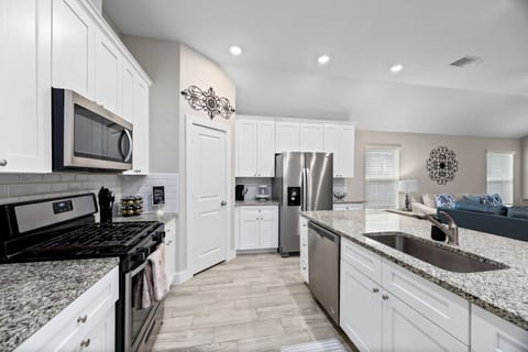 Fully equipped kitchen with ample counter space—great for cooking and group stays