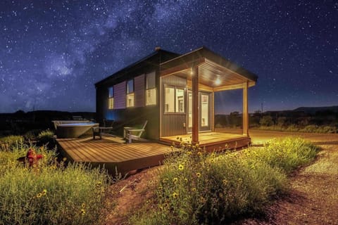 Stargazing at Journey Pines: a cozy Kanab tiny home lit up beneath the Milky Way, private hot tub deck included.