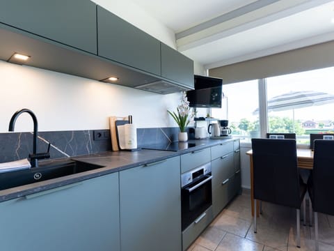 Kitchen, Countertop, Cabinetry, Kitchen Appliance, Interior Design, Flooring, Major Appliance, Furniture, Kitchen Stove, Home Appliance