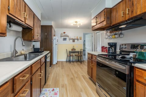 Cook, sip, relax. The kitchen is stocked with everything you need—and the sliding glass door leads straight to fresh mountain air.