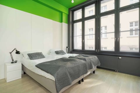Comfortable lounge room with 2 single beds that can be combined into one large bed and TV.