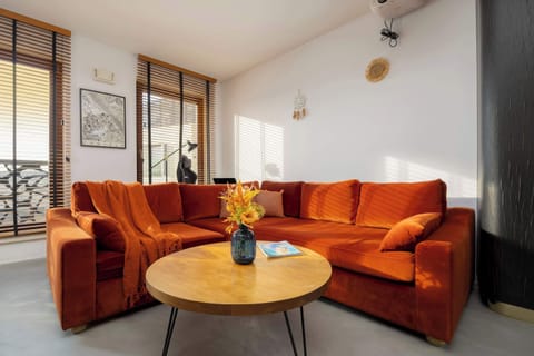 Enjoy your favorite shows on the flat-screen television in the elegant living area.