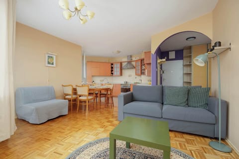 Cozy and spacious living room with a kitchenette.