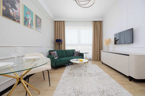 A view of the spacious living room with a comfortable sofa bed.