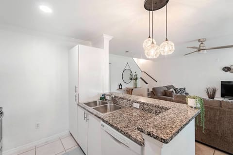 Living room, 50 inch Vizio, smart TV, media charging strip behind TV, lanai