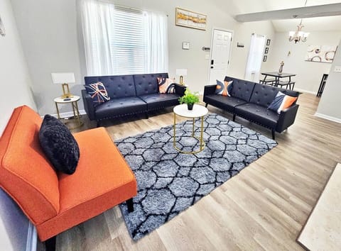 Kick back, relax in this comfy living room, and watch your favorite movie or show on the 55-inch flat-screen smart TV. Both sofas are sleeper beds!