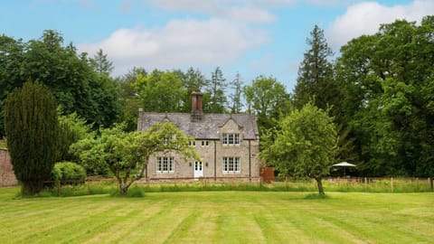 Gardener's Cottage, Twizell Estate - a view of the cottage across the lawns