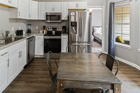Bright white kitchen with modern appliances and everything you need to cook with ease.