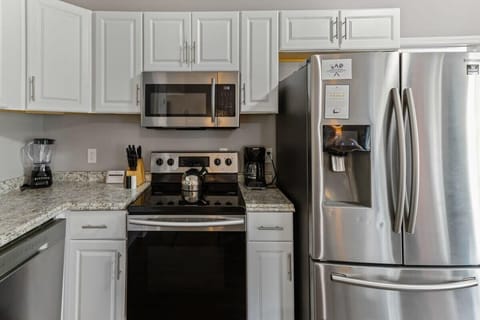 Fully equipped kitchen with stainless steel appliances and plenty of cabinet space.