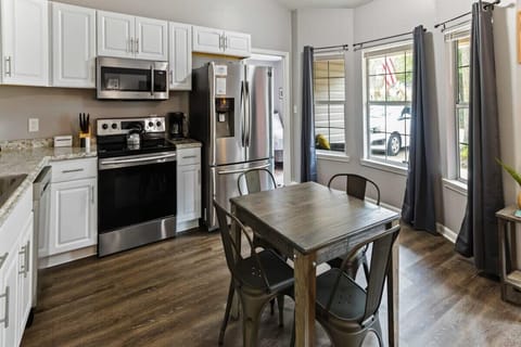 Fully equipped kitchen and dining area ready for home-cooked meals together.