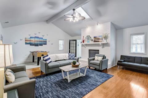 Bright living room with vaulted ceilings and comfy seating.