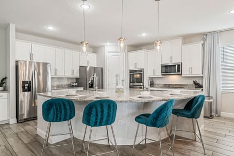 Spacious kitchen with stainless-steel appliances