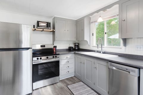 The fully-stocked kitchen comes with new appliances and updated floors.