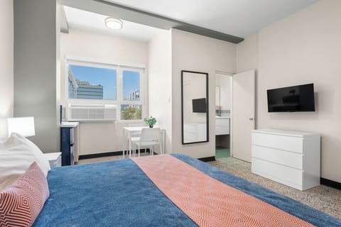 Experience peaceful sleep in our meticulously prepared bedroom, featuring a comfortable bed with fresh linens and soft lighting for a truly restful stay.