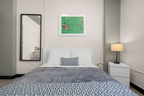 Modern, bright Queen room; the perfect stylish retreat for your stay.	