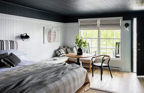 Stretch out in a sunlit suite with cozy seating.