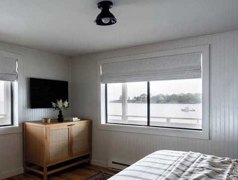 Wake up to serene water views from your bed.
