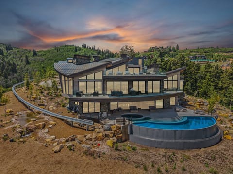 The iconic mansion featured in HBO's Mountainhead film, with views of the mountains of Deer Valley in the background