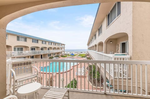 Relax on your private balcony overlooking the resort-style pool with partial ocean views. This beach stay offers easy beach access, coastal breezes, and the perfect spot for your seaside getaway.