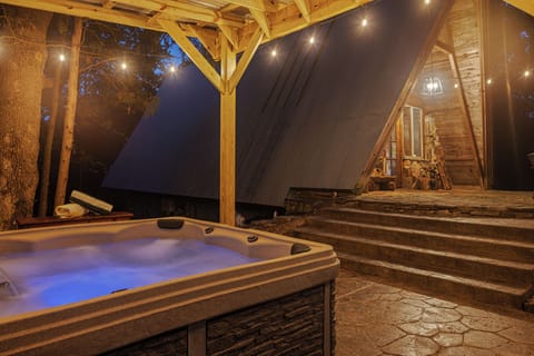 Find your bliss in the hot tub under its own shady pergola.