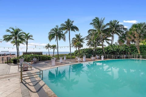 Gather poolside with ocean breezes and sunset-ready seating.