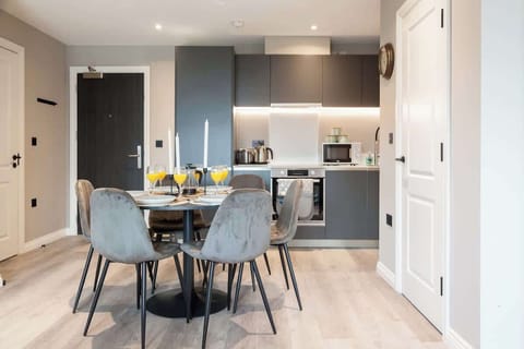 Gather around this elegant dining table, set in a well-lit space that’s perfect for meals, conversations, or a quiet coffee break