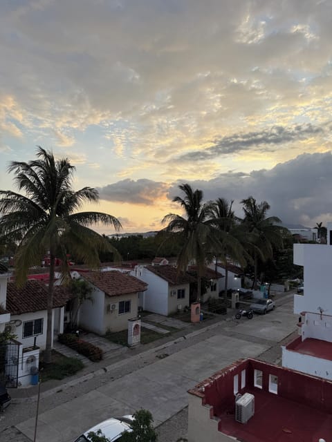 View of the neighborhood and sunset from the rooftop