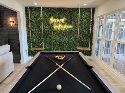 Social media photo wall and pool table.