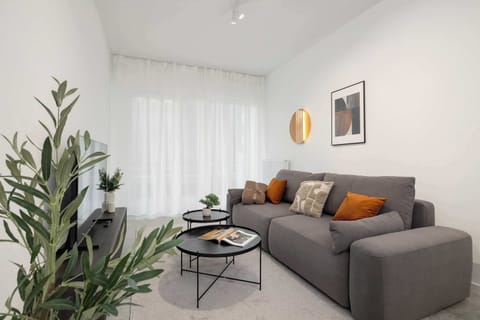 The living room's modern and stylish decor creates a welcoming atmosphere.