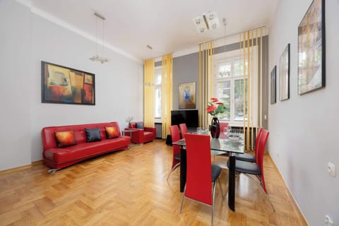 Relax in the stylish bedroom with a comfortable sofa and traditional decor.