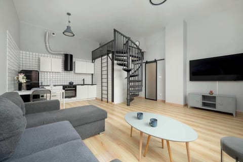 Living room with a comfortable sofa and TV.