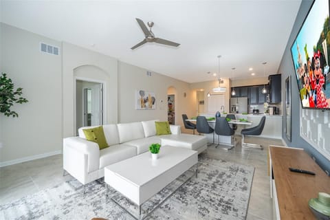 Spacious living room with plush sofas and natural light — relax after Disney adventures in Champions Gate