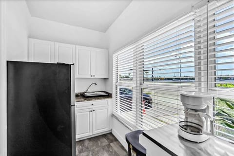 Wake up to coffee and sunshine in this cozy kitchen nook—perfect for remote workers and weekend travelers. Modern appliances, natural light, and comfy seating make it feel like home.
