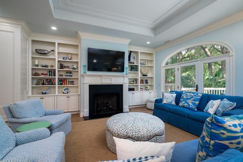 The large great room with soaring ceilings and plenty of seating for all.