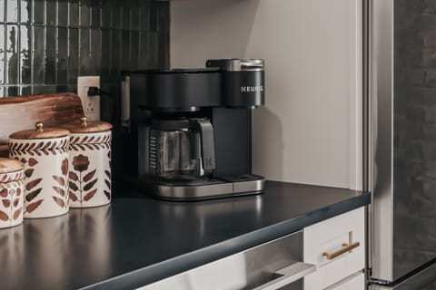 Coffee lovers will appreciate the Keurig Duo, offering the flexibility to brew both K-Cups and fresh local ground coffee—both of which are thoughtfully provided for your stay.