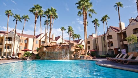 Splash and unwind by the dramatic waterfall lagoon pool.