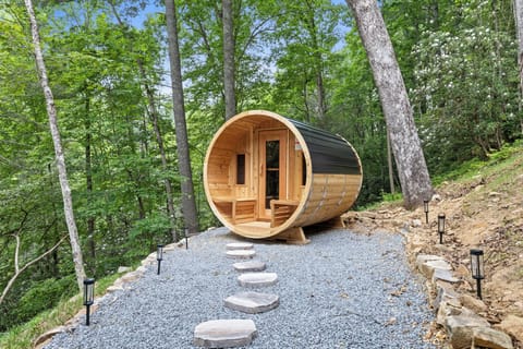 Let the stress melt away in your own private barrel sauna beneath the trees. Guest favorite!