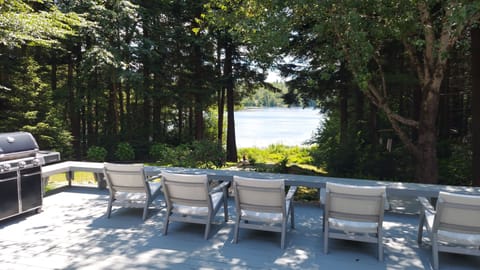 View from massive deck. Fire pit, lawn and lake