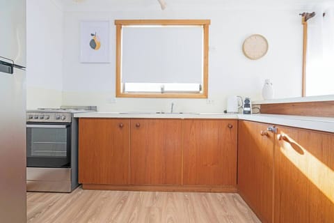 Whip up simple meals or holiday favourites in the well-equipped kitchen, complete with a full-sized fridge, oven with stovetop, and all the essentials for relaxed home cooking.