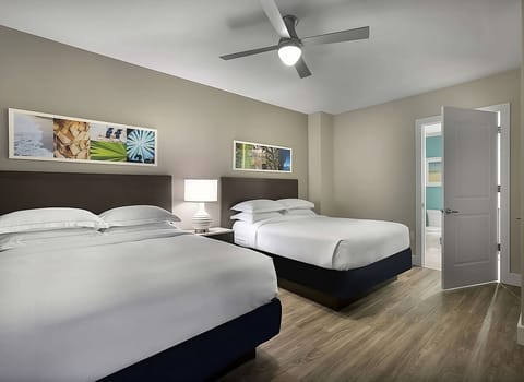 Settle in together with two plush beds and calming décor.