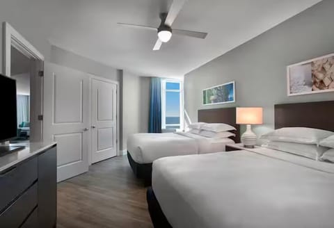 Unwind after adventures in a calm, spacious double-queen room.