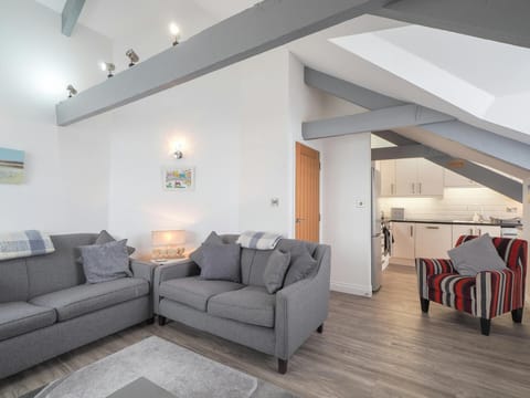 Armchair, sofas, beams in the ceiling