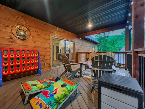 Awesome giant 1/2 covered deck with outdoor furniture, giant games, corn hole, gas grill, beautiful views  and so much more. 