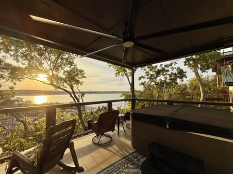 Beautiful Sunsets from Covered Balcony with Hot Tub and plenty of seating.